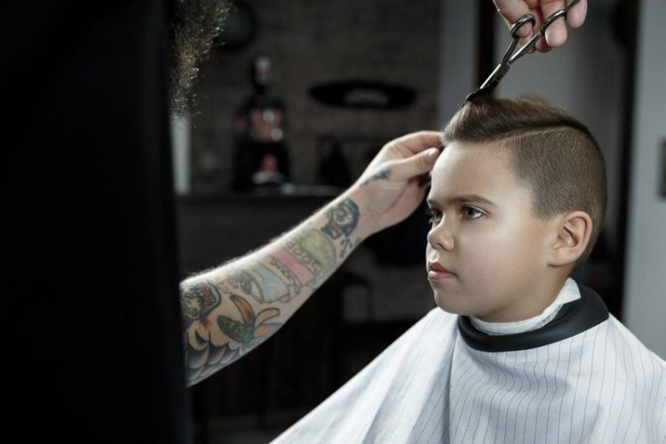 children-hairdresser-cutting-little-boy-barbershop